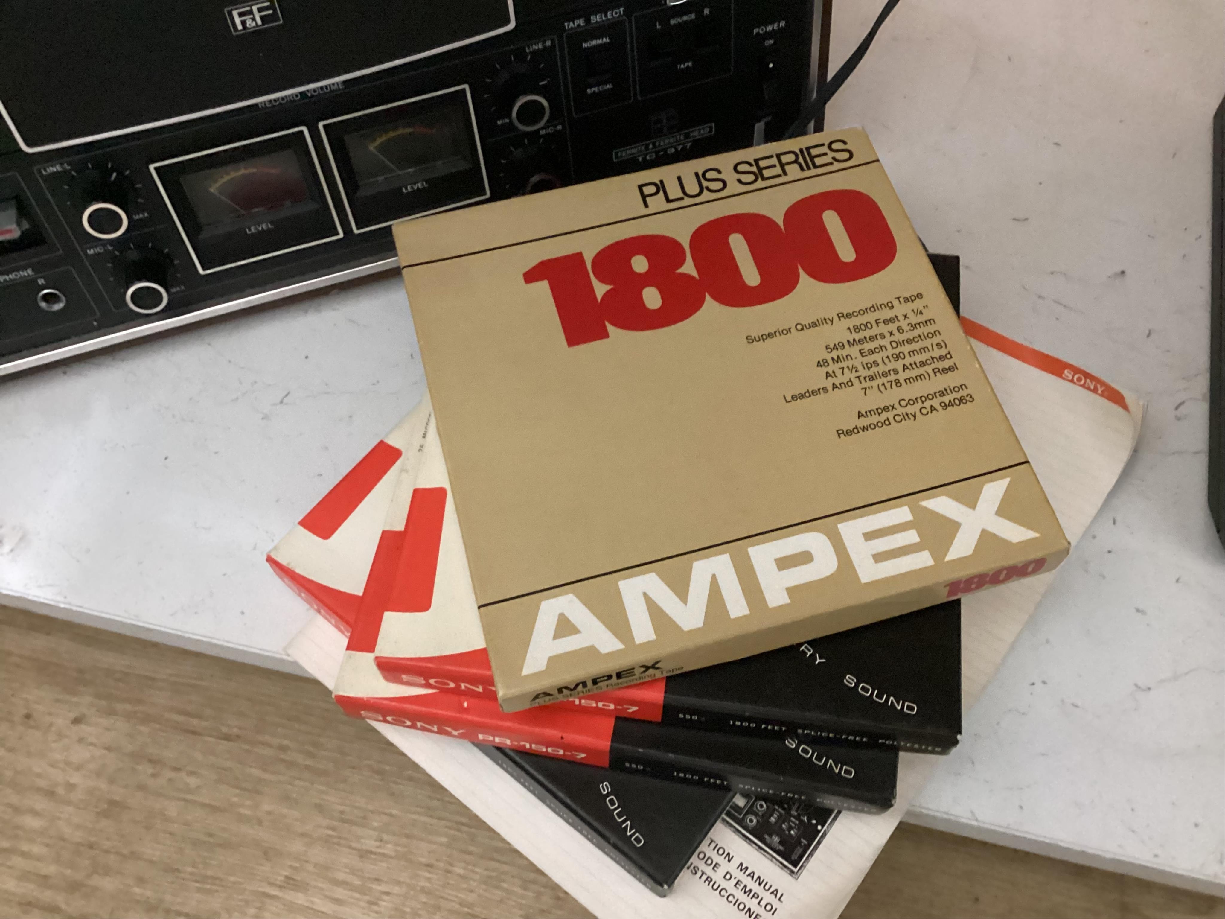 A Sony TC-377 reel to reel tape recorder with the original owners, instruction manual and four boxed reels